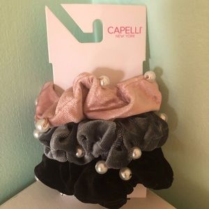3 scrunchies with pearls and a free scrunchie without pearls